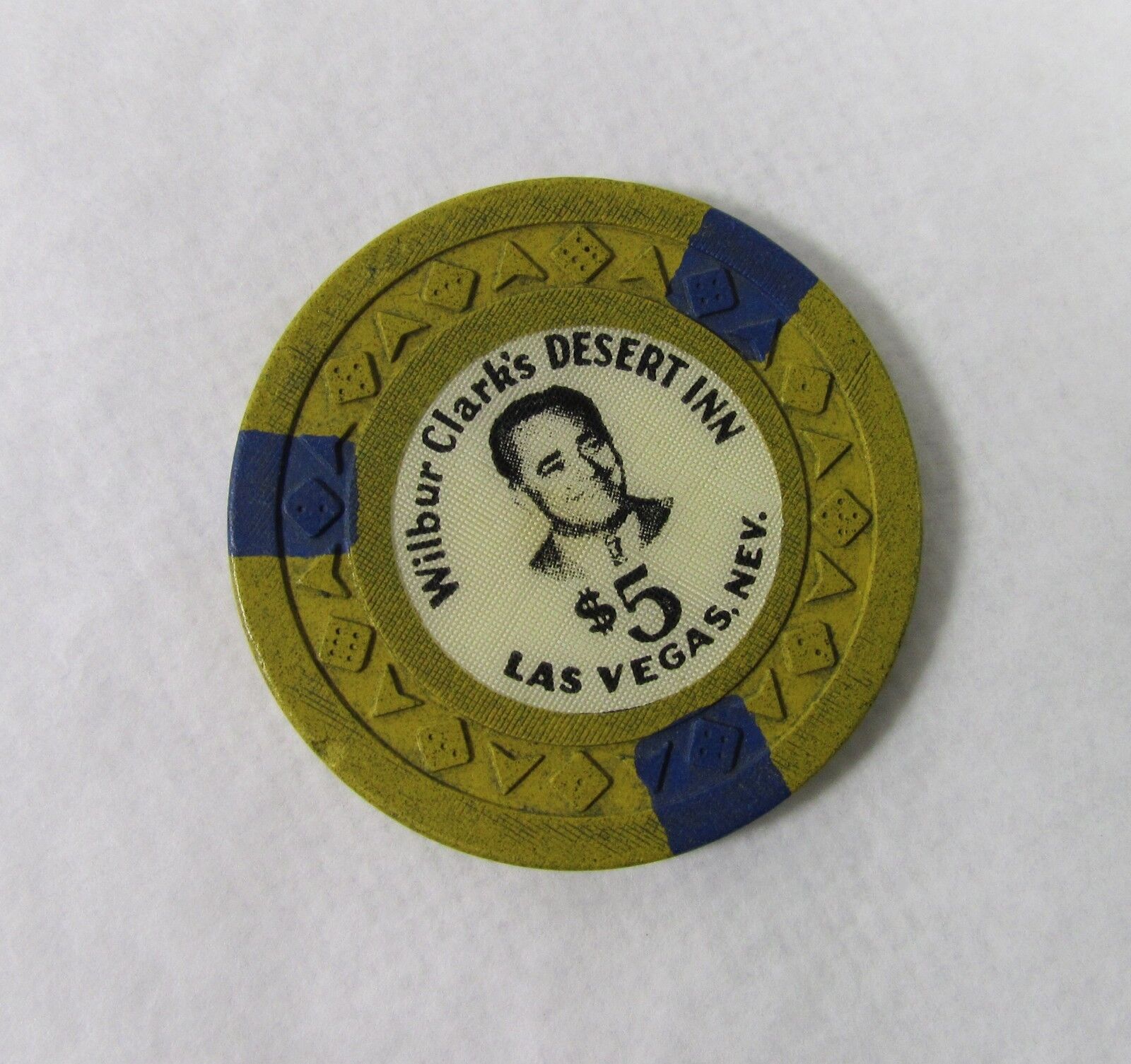 Las Vegas, NV Casino Chip: Wilbur Clark’s Desert Inn $5 Arodie Mustard / Blue R9
