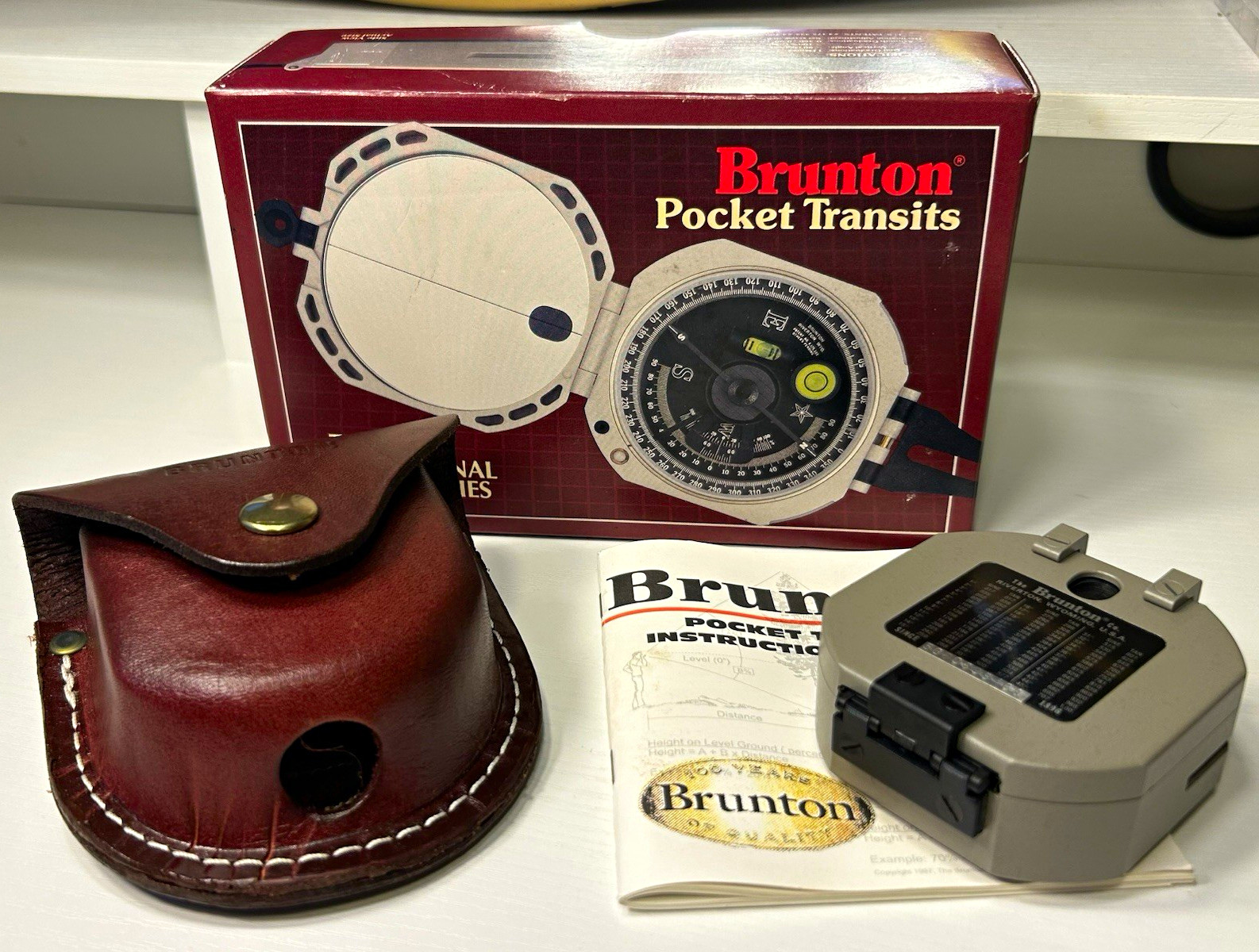 Brunton Pocket Transit Compass Model 37208 w/ Leather Case, Manual & Box Brunton Pocket Transit Compass Model 37208 w/ Leather Case, Manual & Box
