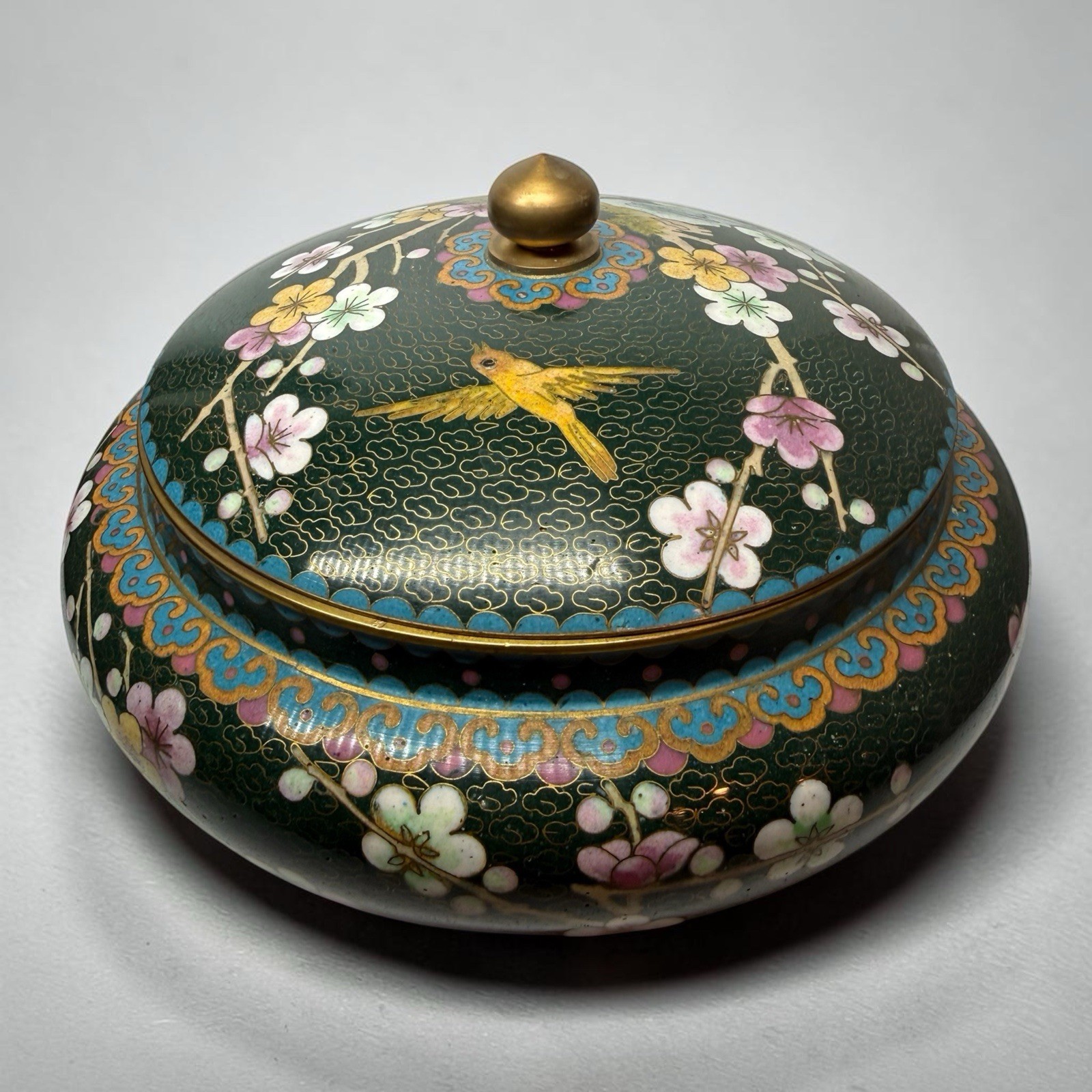 Cloisonné enamel covered box with floral and bird motifs W/ green background
