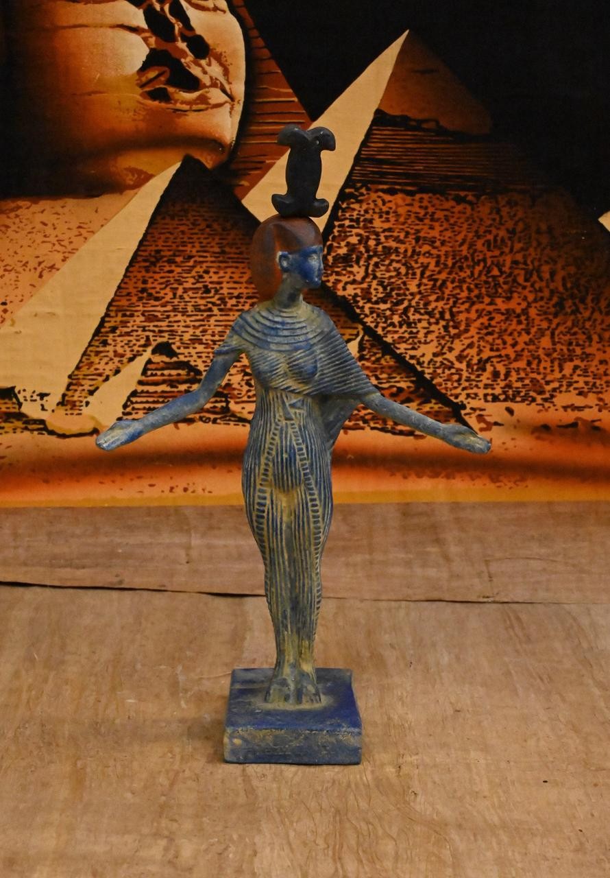 Ancient Egyptian Artifacts goddess Neith holds her symbol above her ...